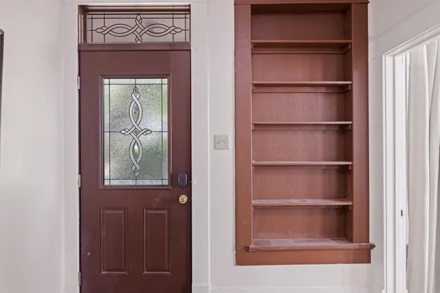 a dining room with furniture and window