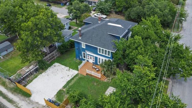 an aerial view of a house with a garden