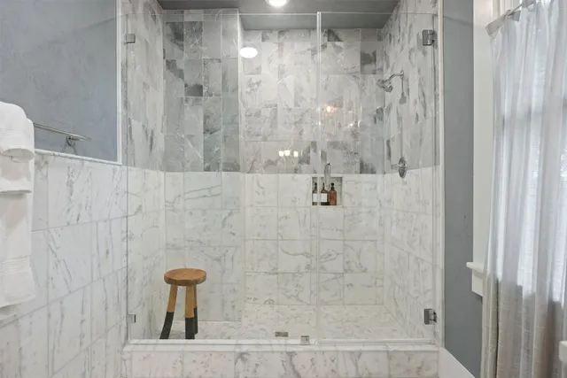 a view of bathroom sink with mirror