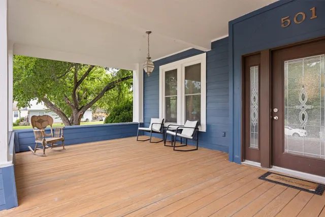 a view of a house with sitting area and wooden floor