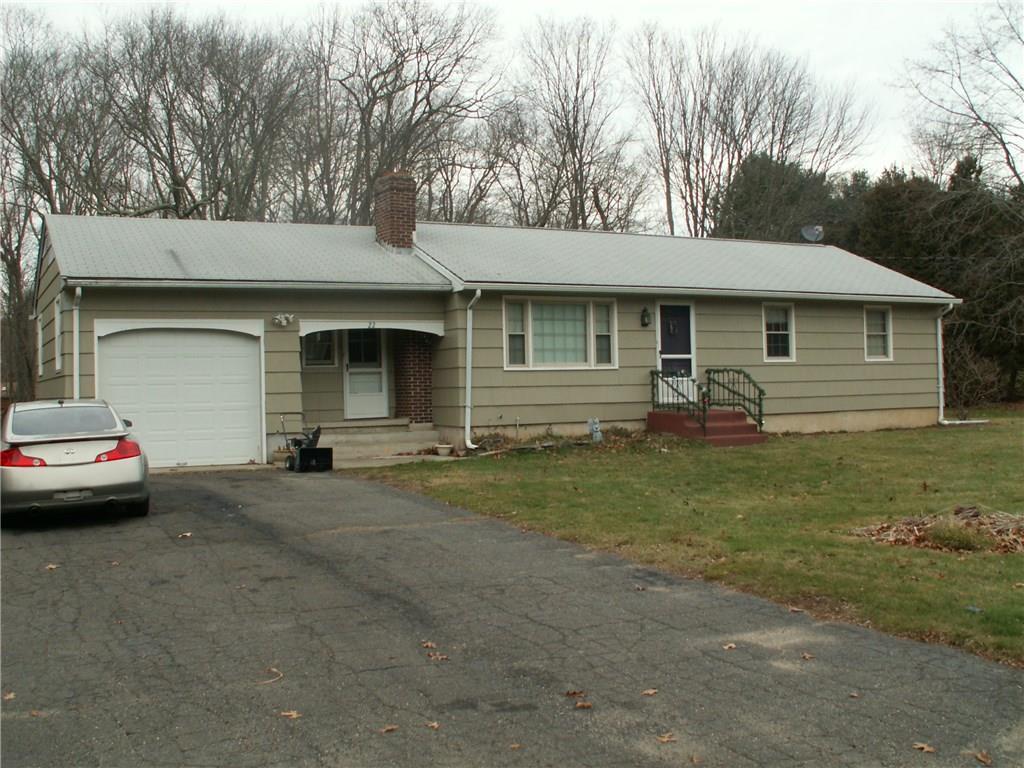 a view of a house with a yard and garage