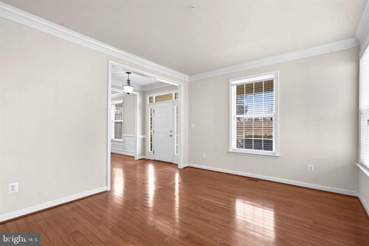 23215 Frederick Road Clarksburg, MD 20871 - Photo 13 of 31 an empty room with wooden floor and windows