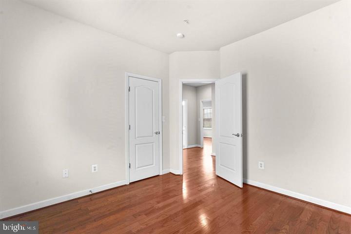 23215 Frederick Road Clarksburg, MD 20871 - Photo 19 of 31 a view of an empty room and wooden floor