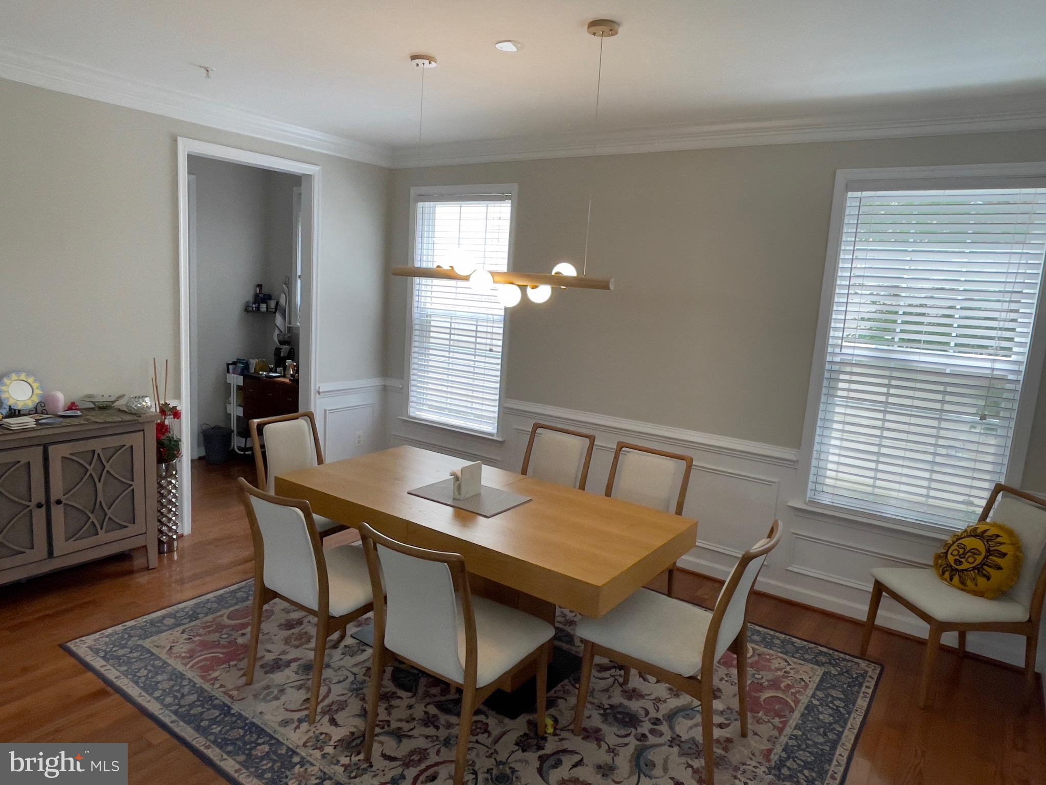 23215 Frederick Road Clarksburg, MD 20871 - Photo 28 of 31 a view of a dining room with furniture and wooden floor