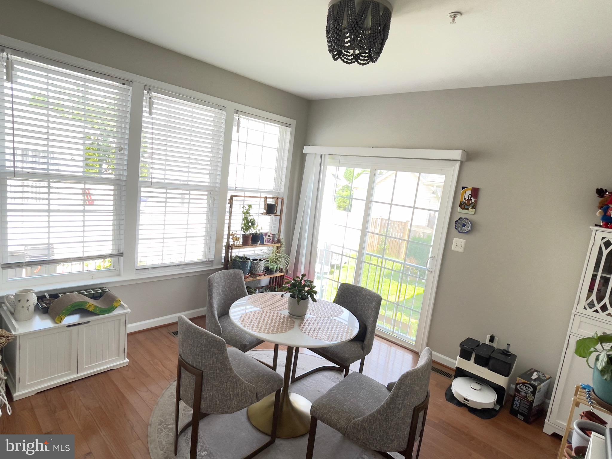 23215 Frederick Road Clarksburg, MD 20871 - Photo 29 of 31 a dining room with furniture and wooden floor