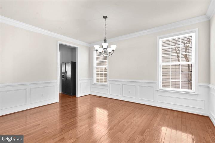 23215 Frederick Road Clarksburg, MD 20871 - Photo 10 of 31 a view of wooden floor chandelier and window in a room