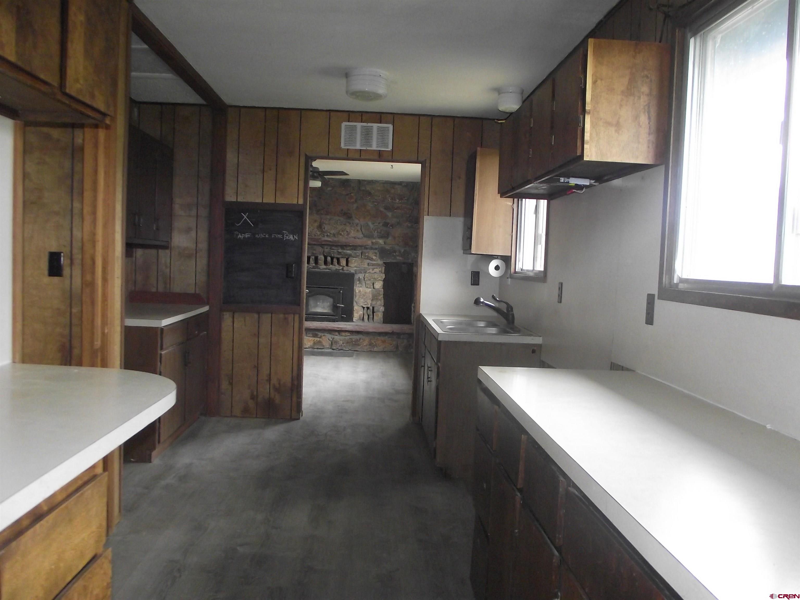 42996 Needle Rock Road Crawford, CO 81415 - Photo 23 of 45 a kitchen with stainless steel appliances a sink stove and refrigerator