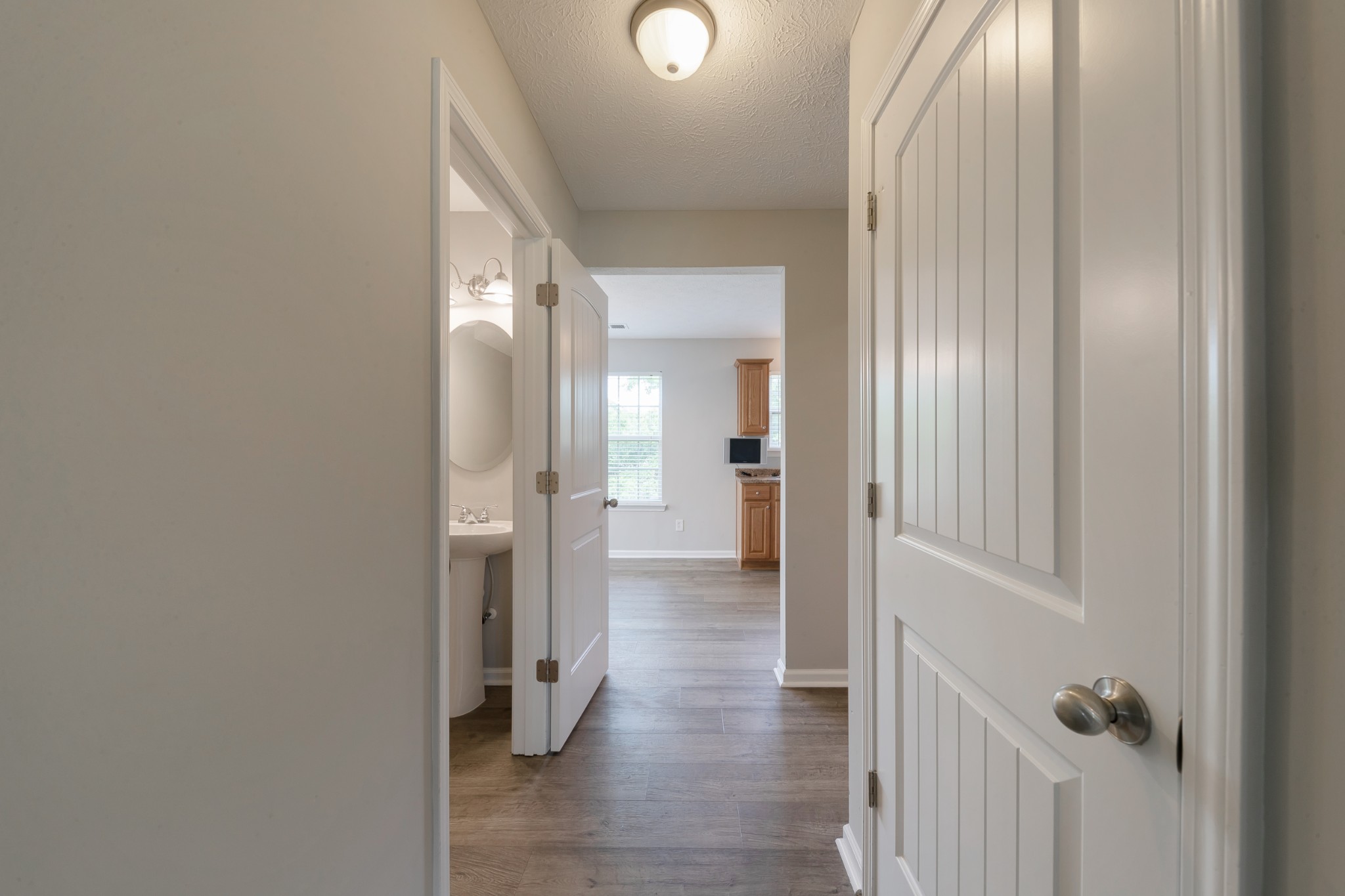 921 Woodall Road Lebanon, TN 37090 - Photo 10 of 30 a view of a hallway with wooden floor