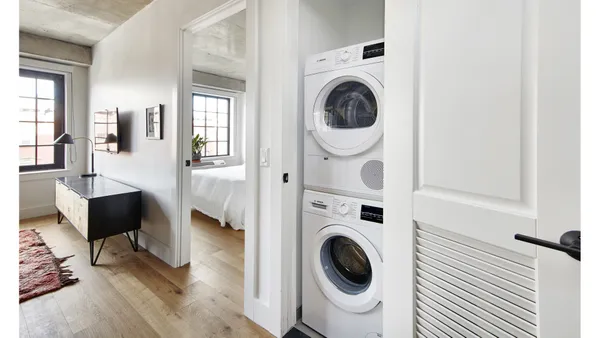 a view of entryway with washer and dryer