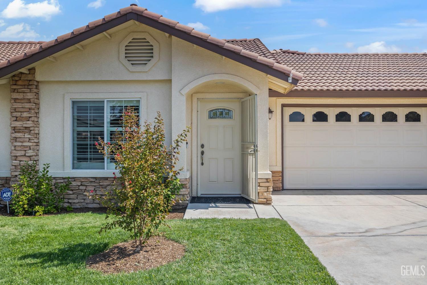 Undisclosed Address Taft, CA 93268 - Photo 15 of 60 a front view of a house with a yard