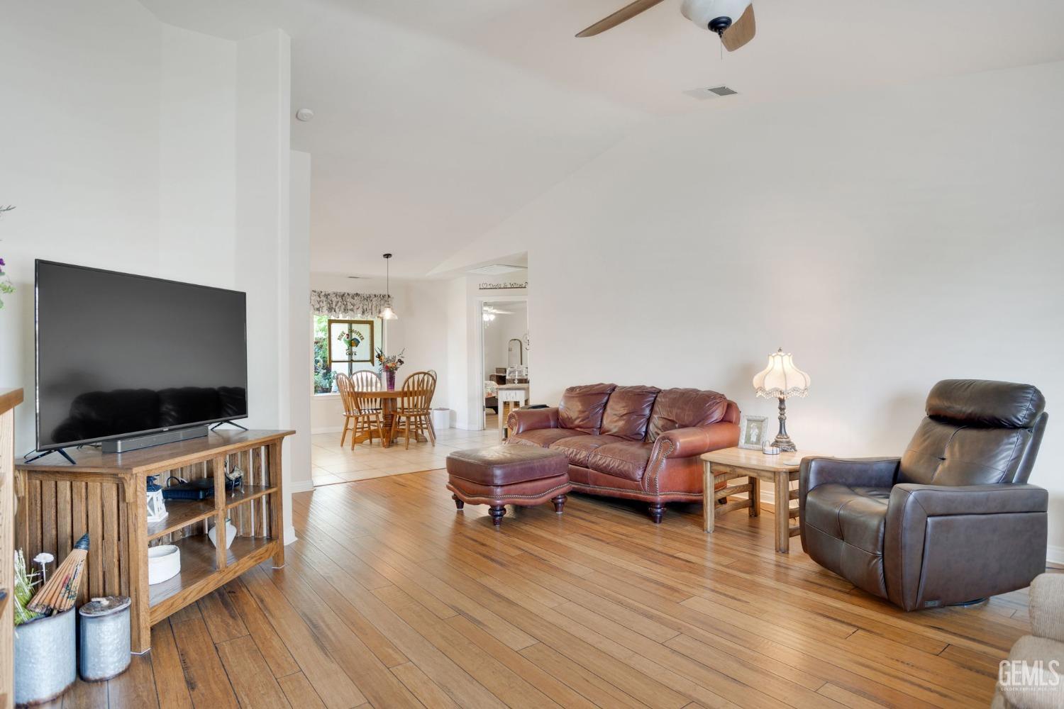 Undisclosed Address Taft, CA 93268 - Photo 23 of 60 a living room with furniture and a flat screen tv