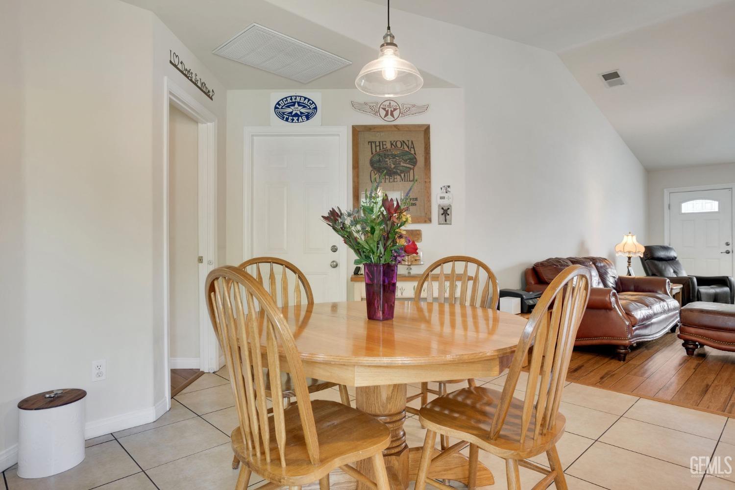 Undisclosed Address Taft, CA 93268 - Photo 25 of 60 a view of a dining room with furniture and chandelier