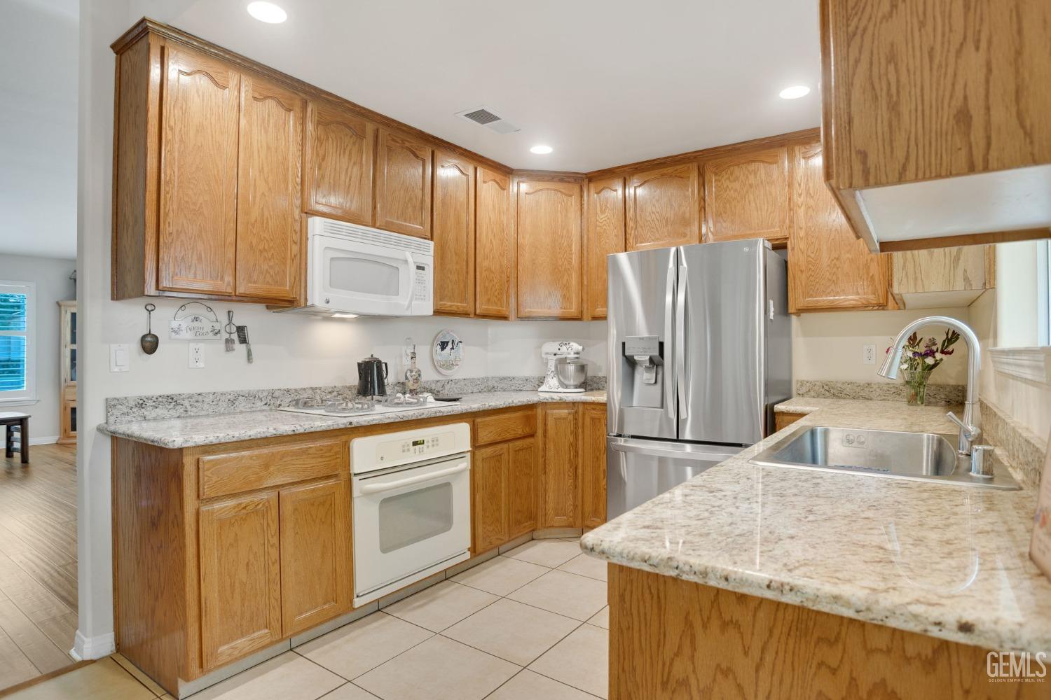 Undisclosed Address Taft, CA 93268 - Photo 27 of 60 a kitchen with stainless steel appliances granite countertop a sink stove and refrigerator