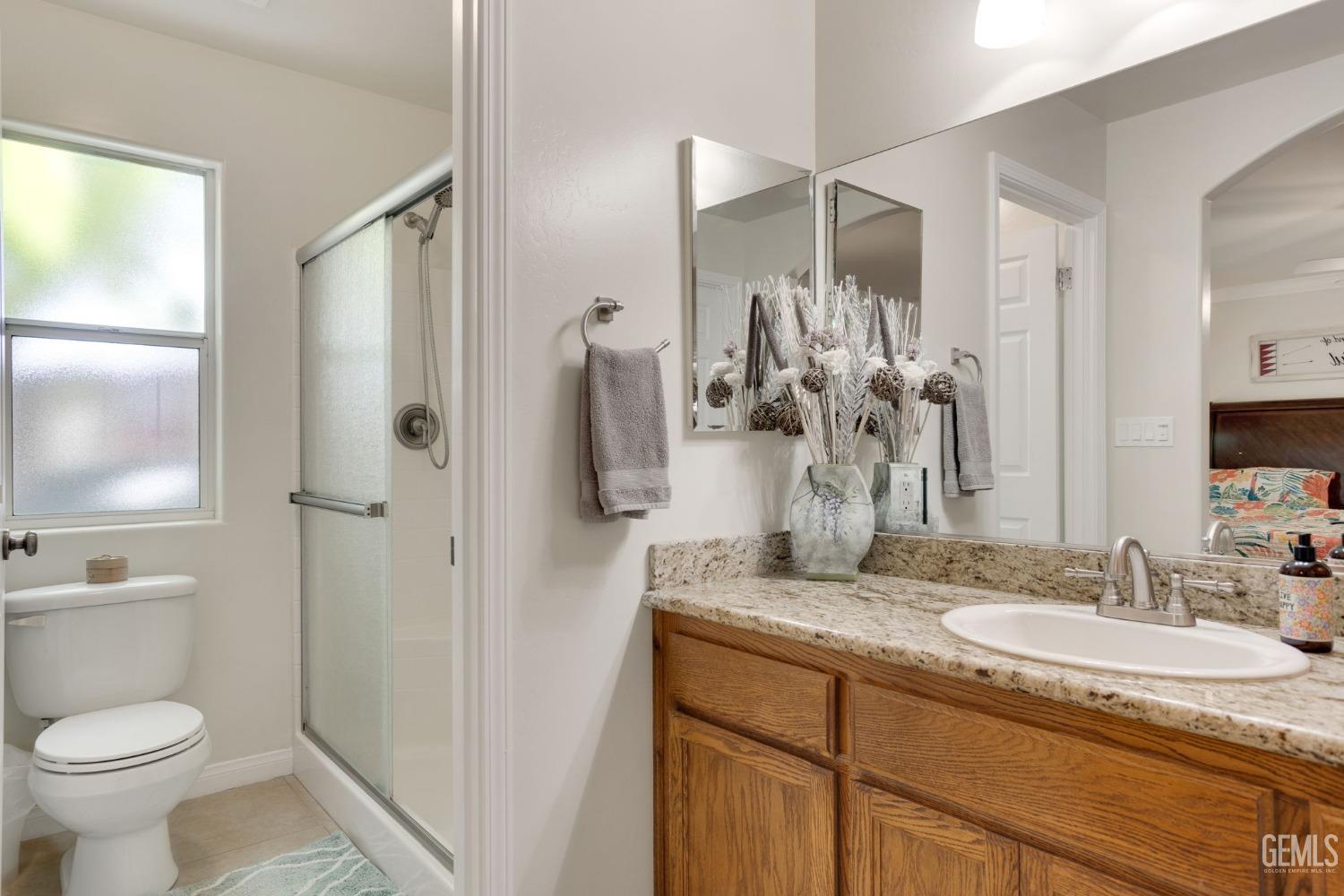 Undisclosed Address Taft, CA 93268 - Photo 40 of 60 a bathroom with a granite countertop sink toilet and shower