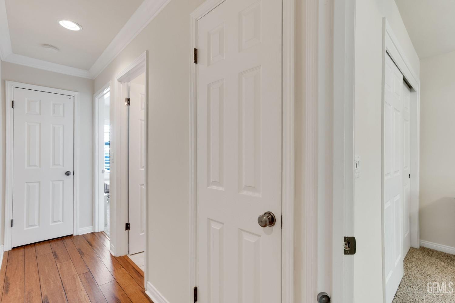 Undisclosed Address Taft, CA 93268 - Photo 41 of 60 a view of a hallway with wooden floor and a bathroom