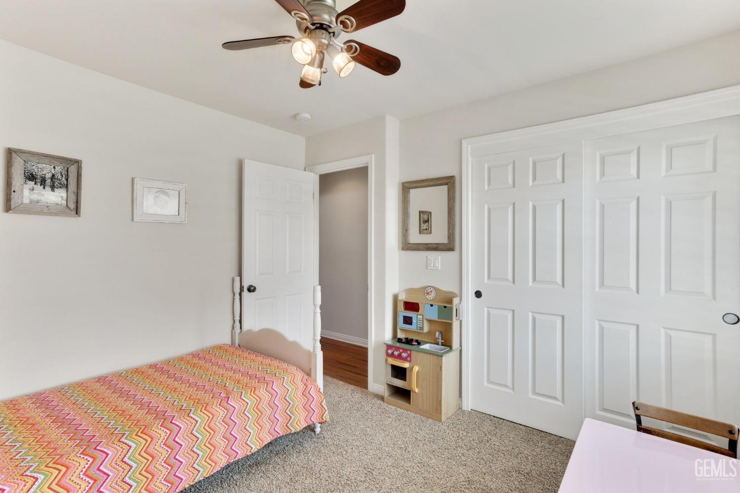 Undisclosed Address Taft, CA 93268 - Photo 43 of 60 a bedroom with a bed and a chandelier