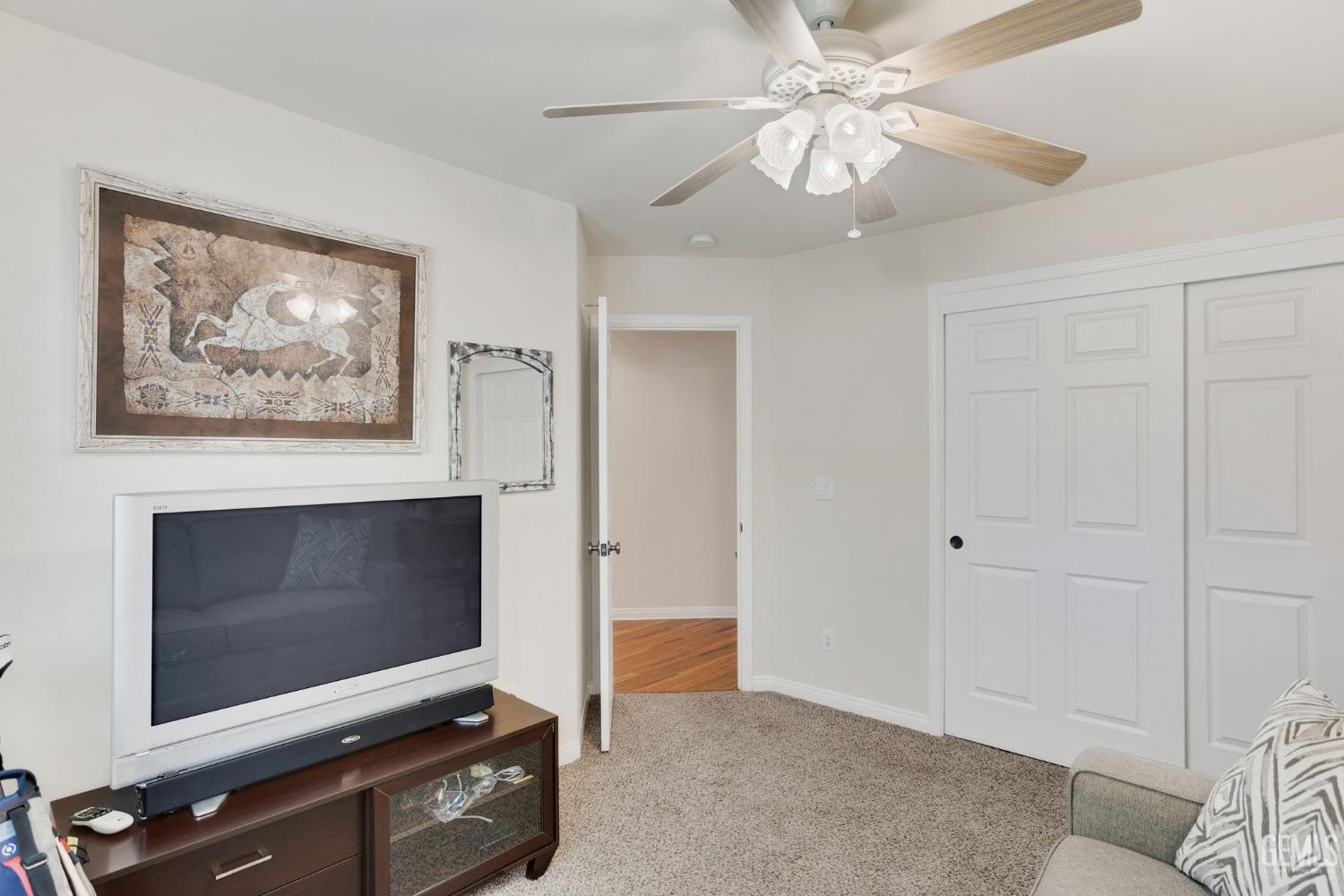Undisclosed Address Taft, CA 93268 - Photo 46 of 60 a living room with a flat screen tv and a fireplace