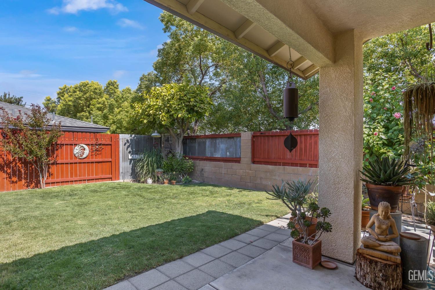 Undisclosed Address Taft, CA 93268 - Photo 47 of 60 a view of a yard with potted plants and a large tree