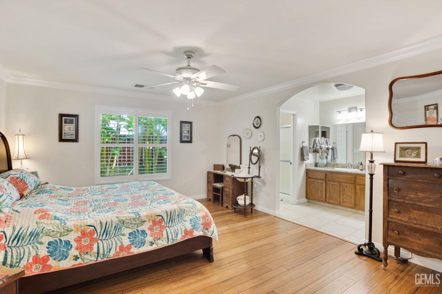 Undisclosed Address Taft, CA 93268 - Photo 5 of 60 a bedroom with a bed and a chandelier