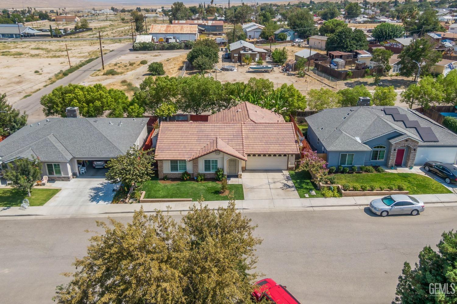 Undisclosed Address Taft, CA 93268 - Photo 52 of 60 an aerial view of multiple houses with a street