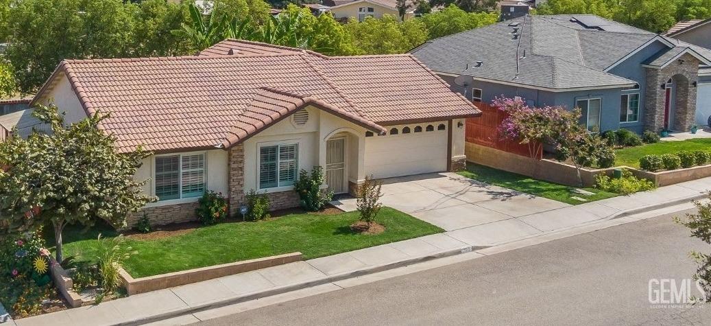 Undisclosed Address Taft, CA 93268 - Photo 56 of 60 a aerial view of a house with a yard
