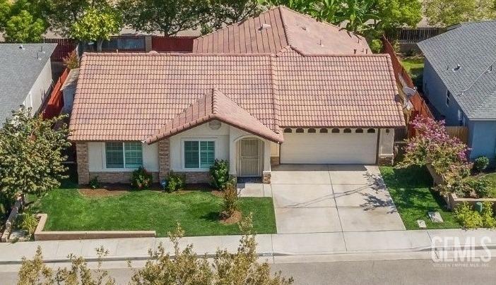 Undisclosed Address Taft, CA 93268 - Photo 57 of 60 a front view of a house with garden