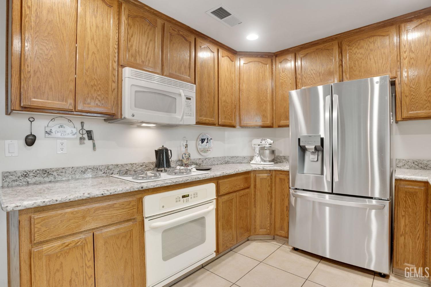 Undisclosed Address Taft, CA 93268 - Photo 6 of 60 a kitchen with stainless steel appliances granite countertop a refrigerator sink and cabinets