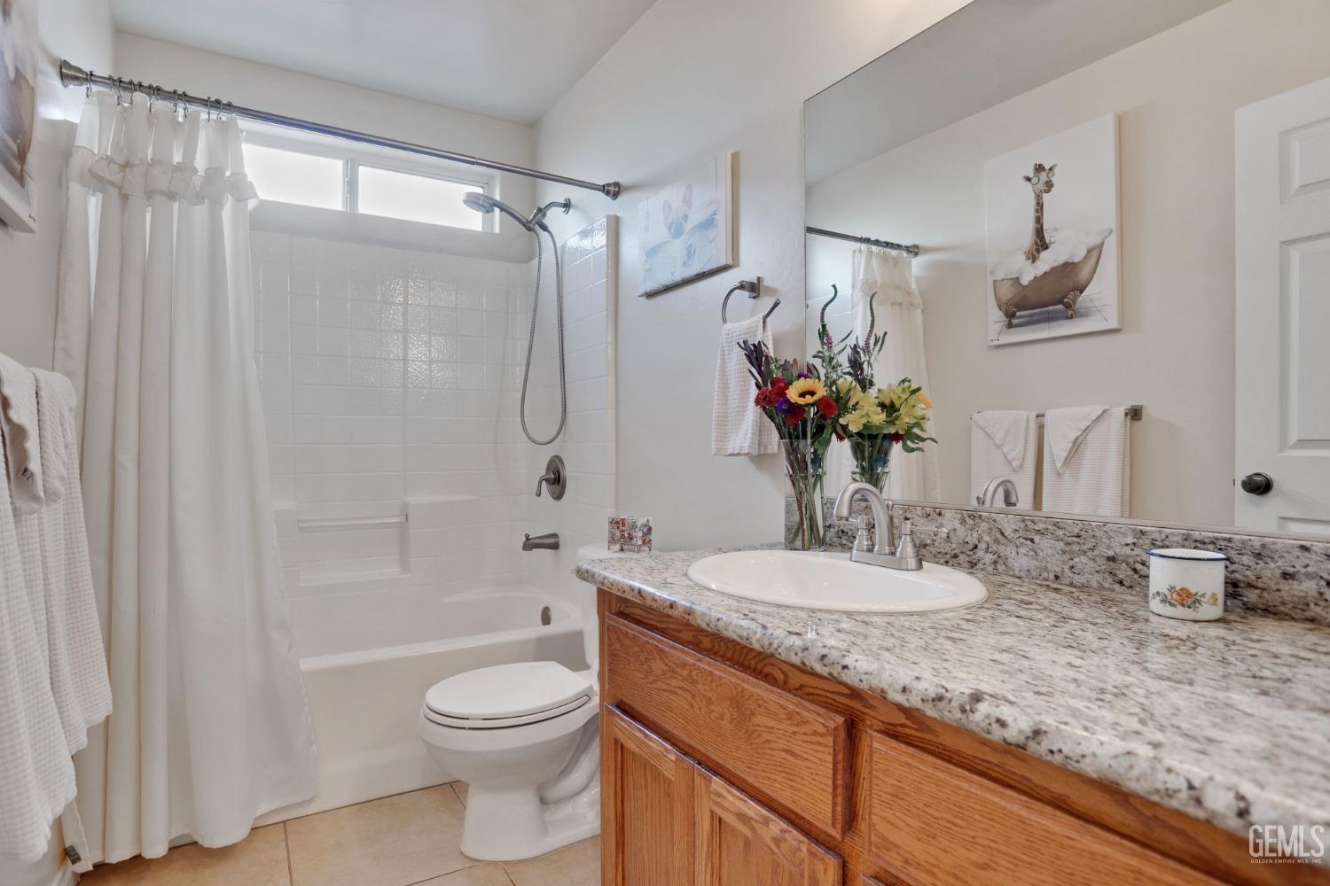 Undisclosed Address Taft, CA 93268 - Photo 9 of 60 a bathroom with a granite countertop sink toilet and shower
