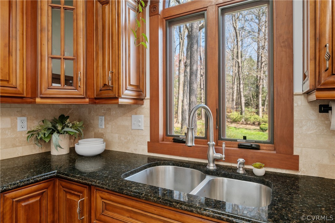 6218 Willow Glen Road Midlothian, VA 23112 - Photo 12 of 45 a kitchen with granite countertop a sink and a window