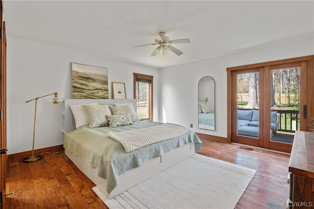 6218 Willow Glen Road Midlothian, VA 23112 - Photo 17 of 45 a spacious bedroom with a large bed and a chandelier