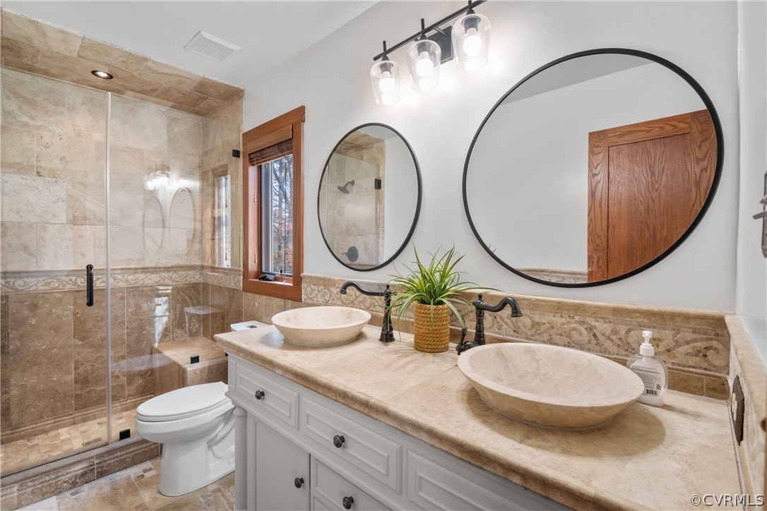 6218 Willow Glen Road Midlothian, VA 23112 - Photo 19 of 45 a bathroom with a granite countertop toilet a sink and a mirror