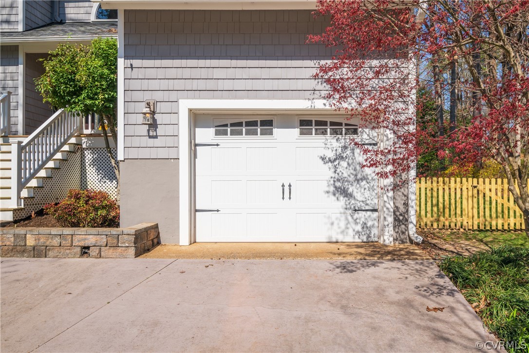 6218 Willow Glen Road Midlothian, VA 23112 - Photo 32 of 45 a front view of a house with a yard and garage