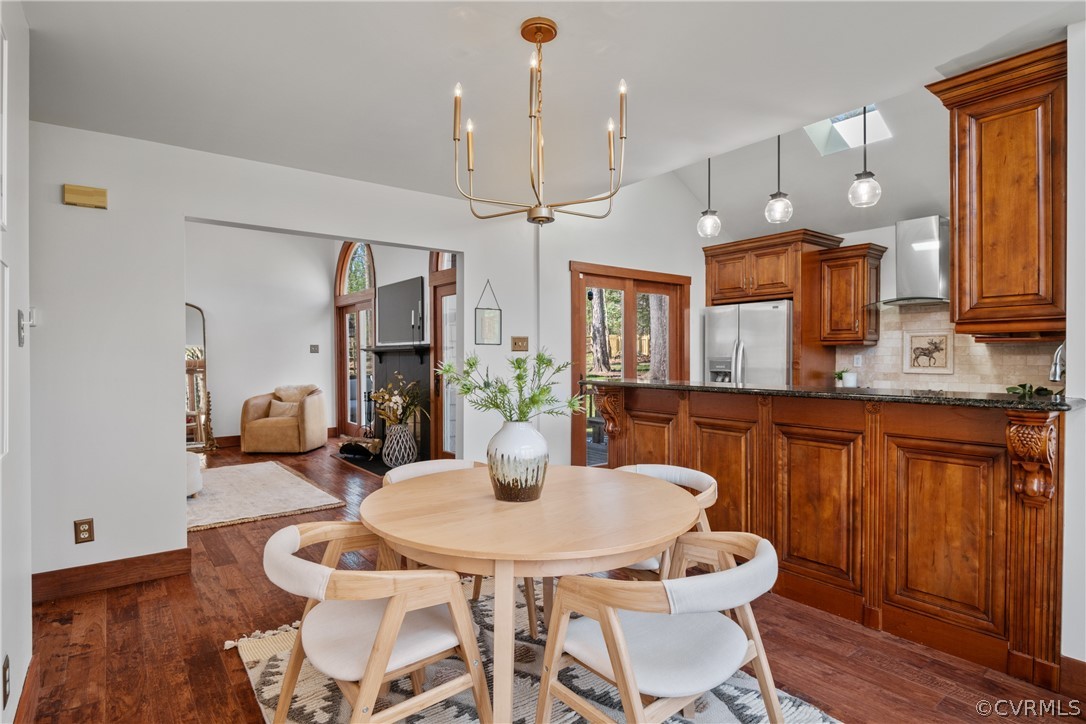6218 Willow Glen Road Midlothian, VA 23112 - Photo 9 of 45 a kitchen with a dining table and chairs