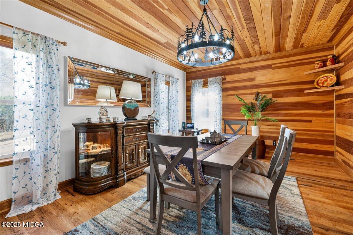 306 Thomson Street Centerville, GA 31028 - Photo 12 of 38 a view of a dining room with furniture and a chandelier
