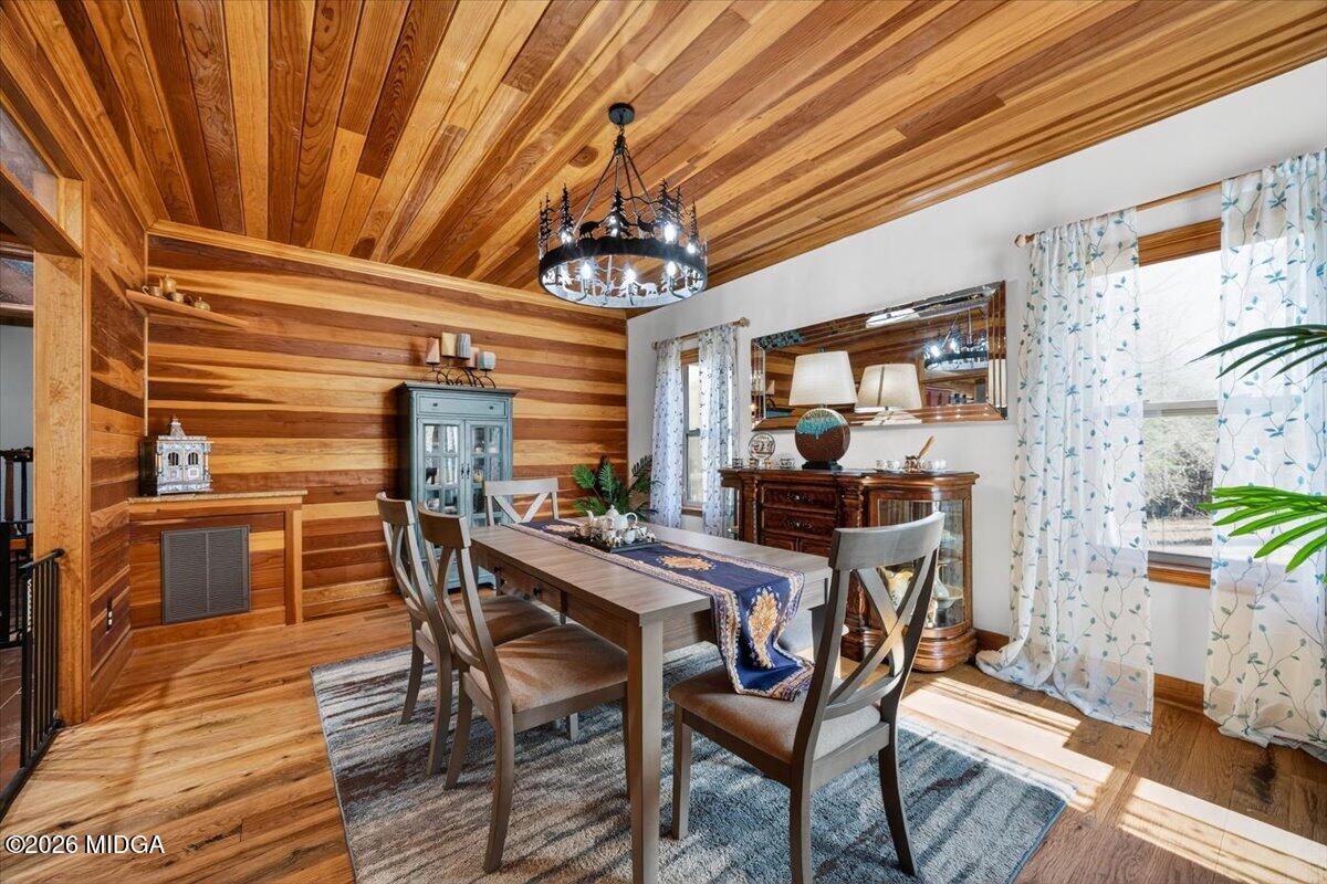 306 Thomson Street Centerville, GA 31028 - Photo 13 of 38 a view of a dining room with furniture and chandelier