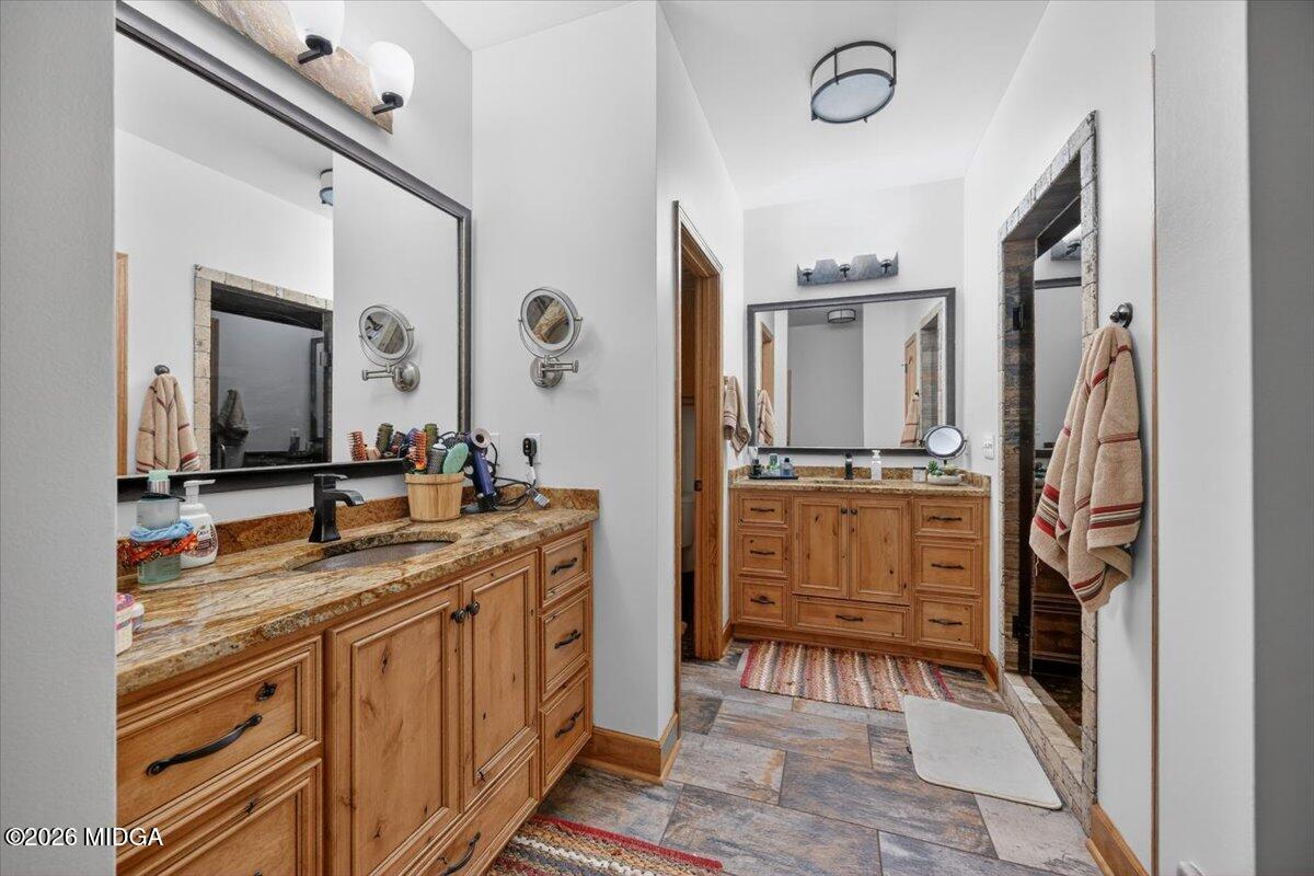 306 Thomson Street Centerville, GA 31028 - Photo 14 of 38 a bathroom with a sink and a mirror