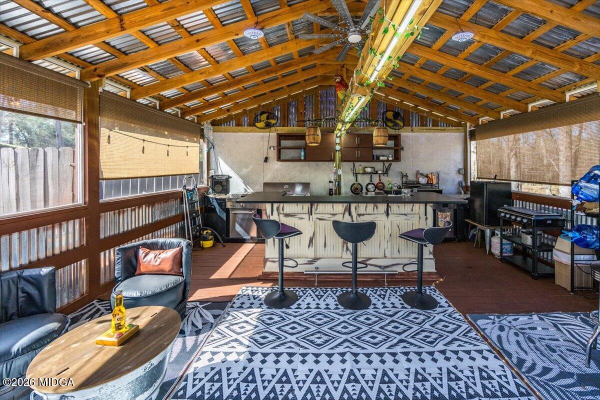 306 Thomson Street Centerville, GA 31028 - Photo 20 of 38 a living room with lots of furniture and a rug