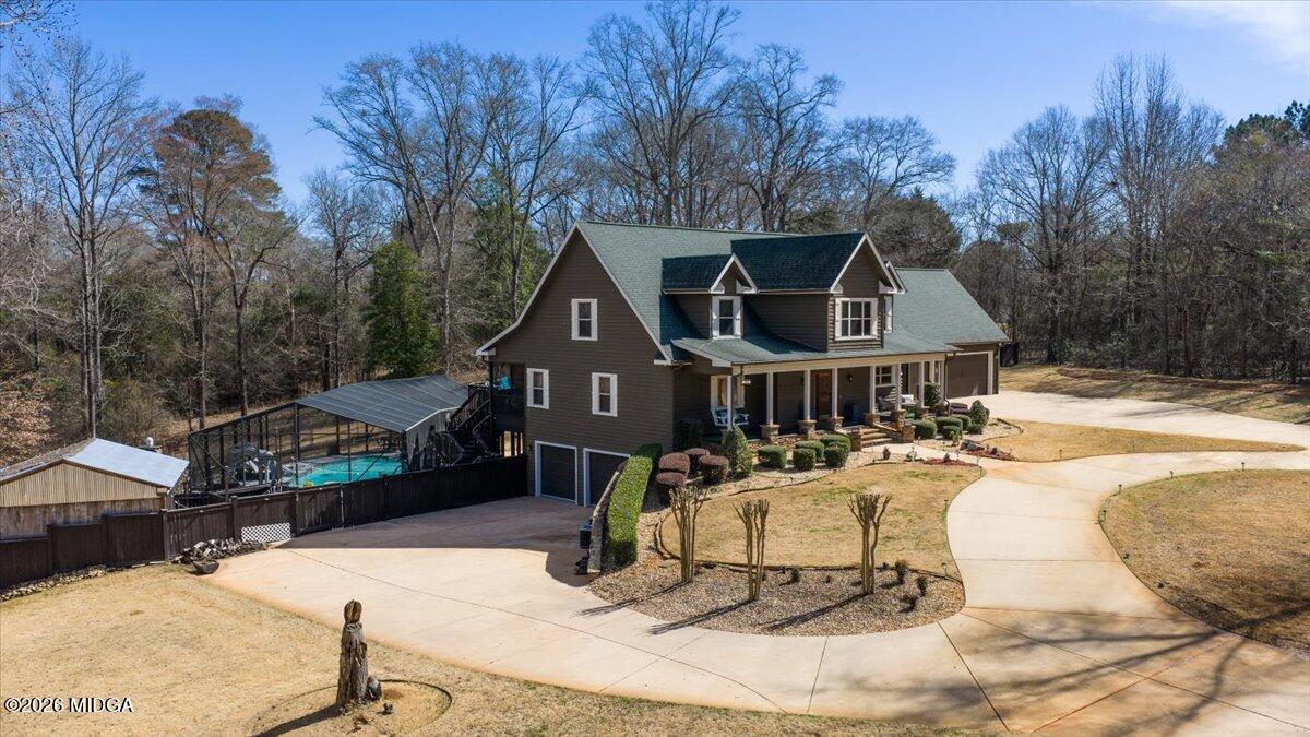 306 Thomson Street Centerville, GA 31028 - Photo 2 of 38 a front view of a house with a yard