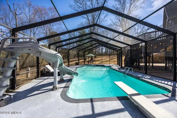 a view of a swimming pool with a patio