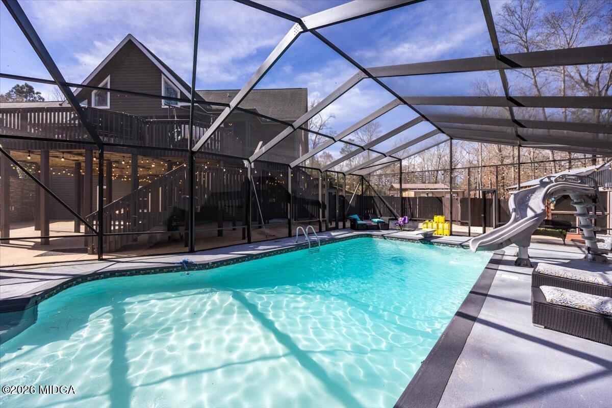 306 Thomson Street Centerville, GA 31028 - Photo 26 of 38 a view of a backyard with swimming pool