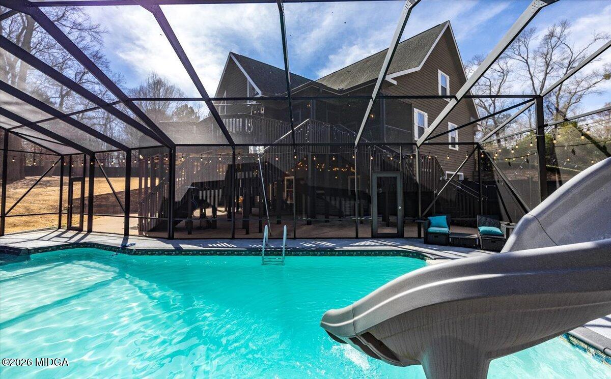 306 Thomson Street Centerville, GA 31028 - Photo 27 of 38 a view of a backyard with sitting area