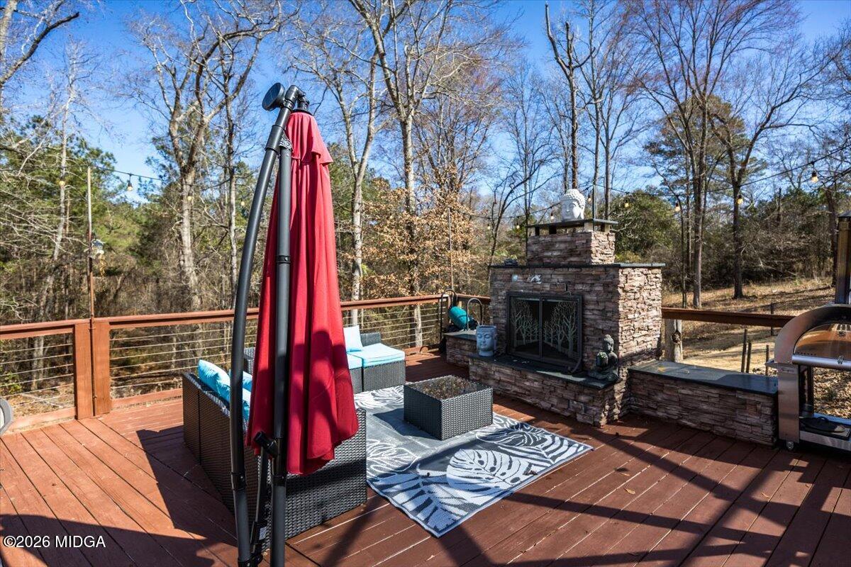 306 Thomson Street Centerville, GA 31028 - Photo 29 of 38 a view of a chairs and fire pit in the backyard