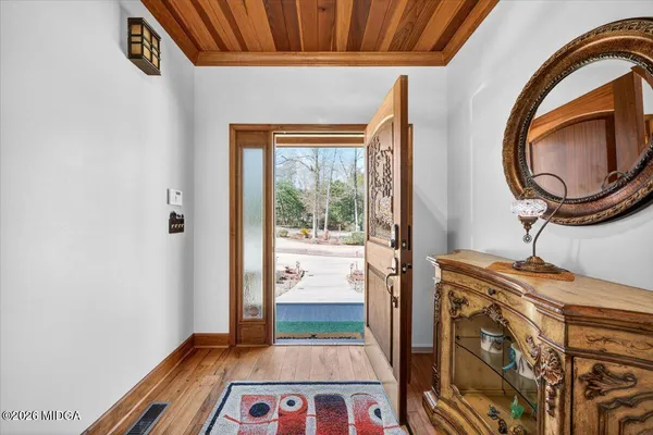 a view of an entryway with a door