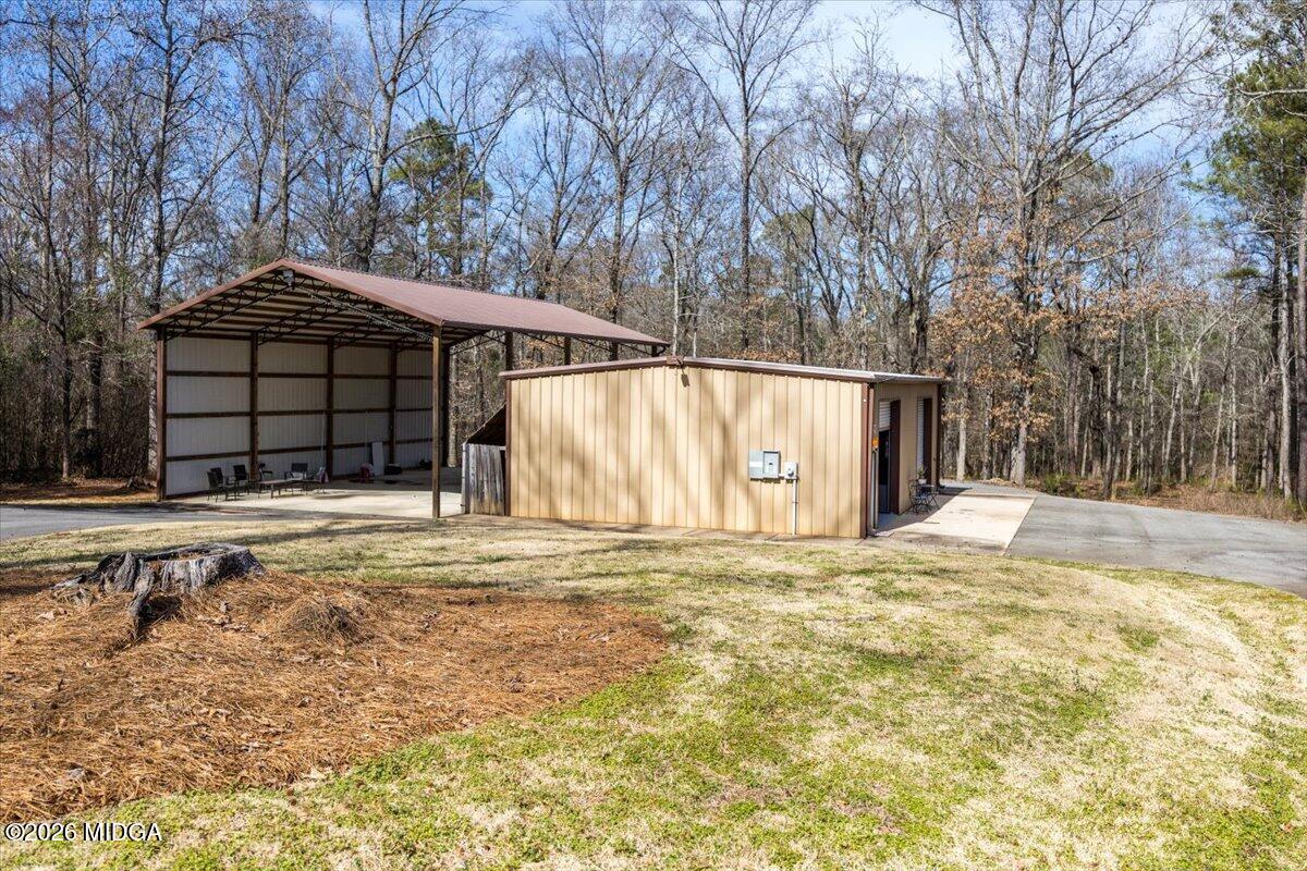 306 Thomson Street Centerville, GA 31028 - Photo 31 of 38 a house view with a outdoor space