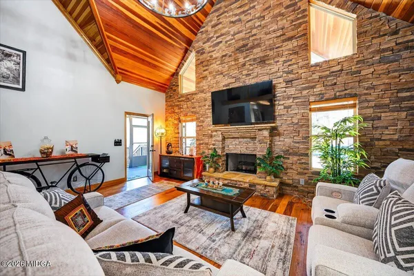 a outdoor living space with patio furniture and a fireplace