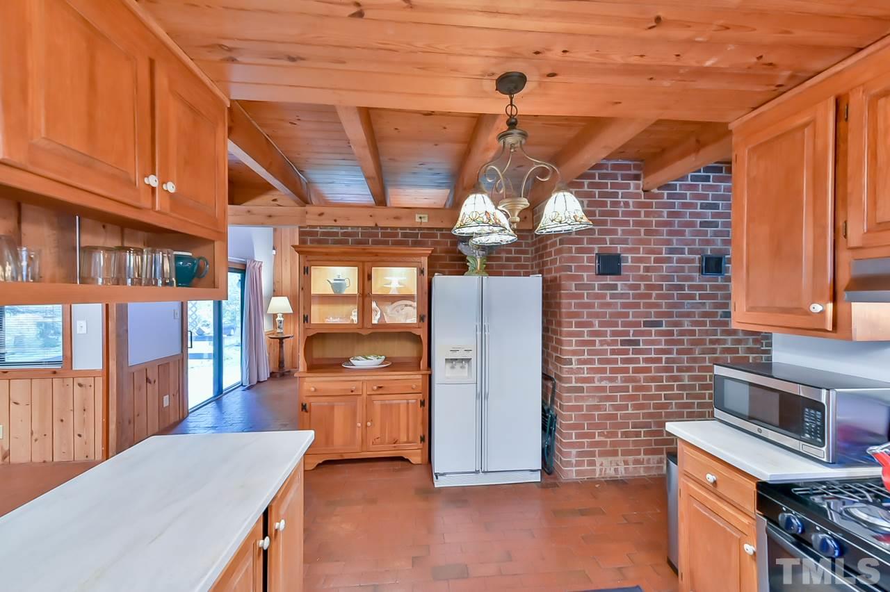 214 Clark Lake Road Durham, NC 27707 - Photo 15 of 30 a view of a kitchen with furniture and windows
