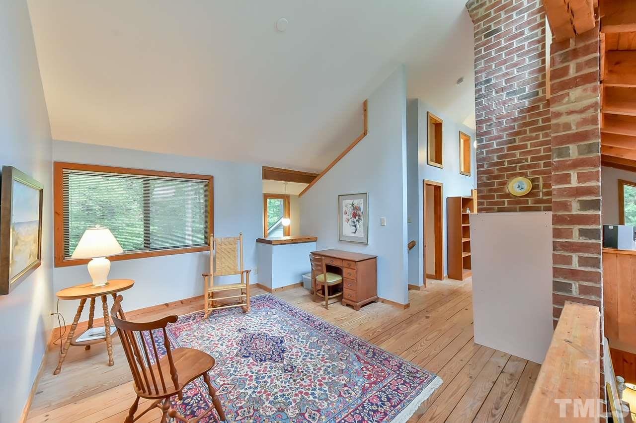 214 Clark Lake Road Durham, NC 27707 - Photo 20 of 30 a living room with furniture a window and wooden floor