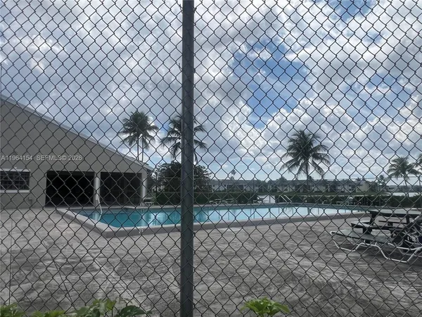a view of a wrought iron fences in front of a house