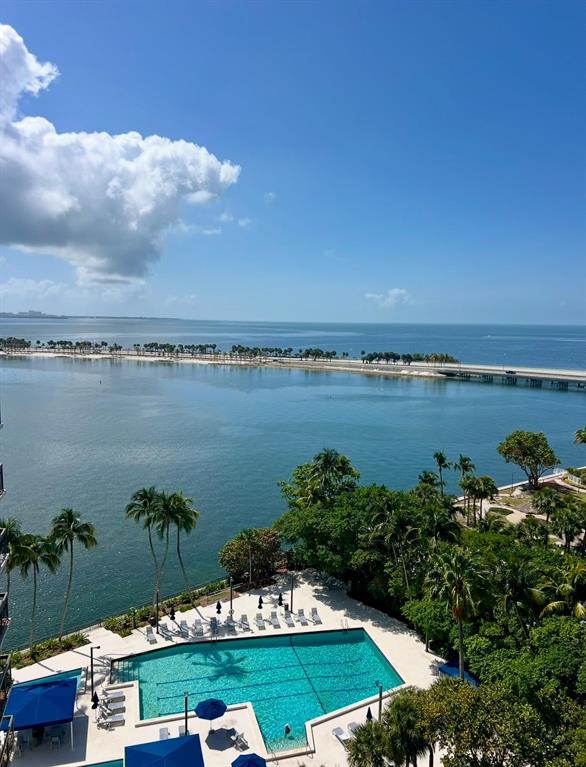 a view of a lake with houses in the back