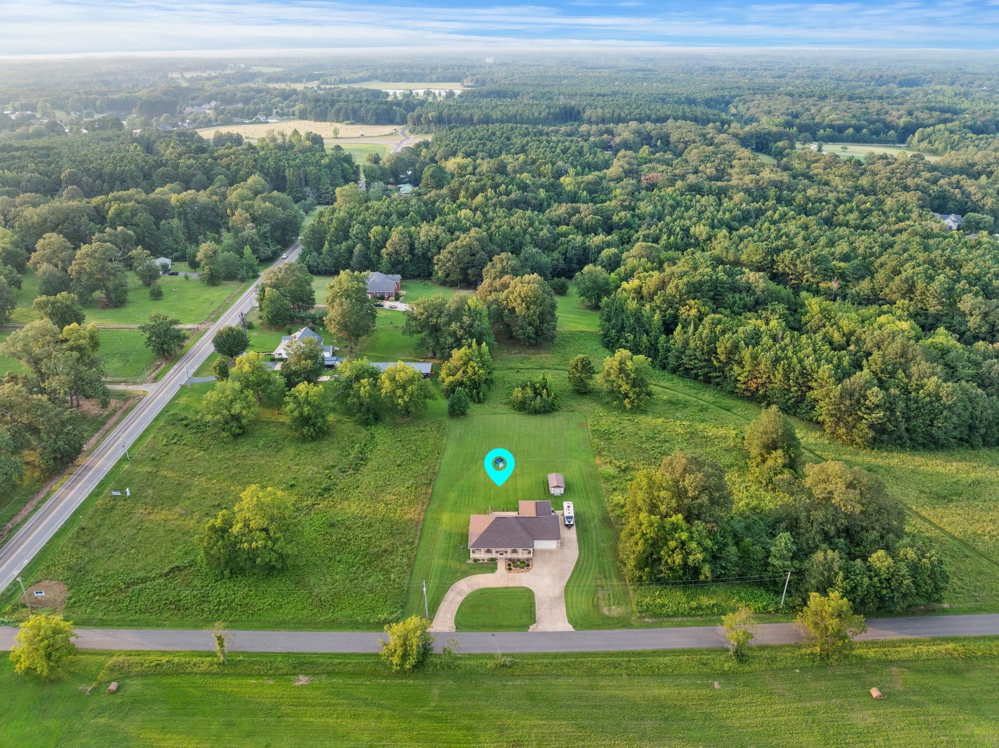27 Bynum Drive Corinth, MS 38834 - Photo 32 of 36 a view of a golf course with a lake